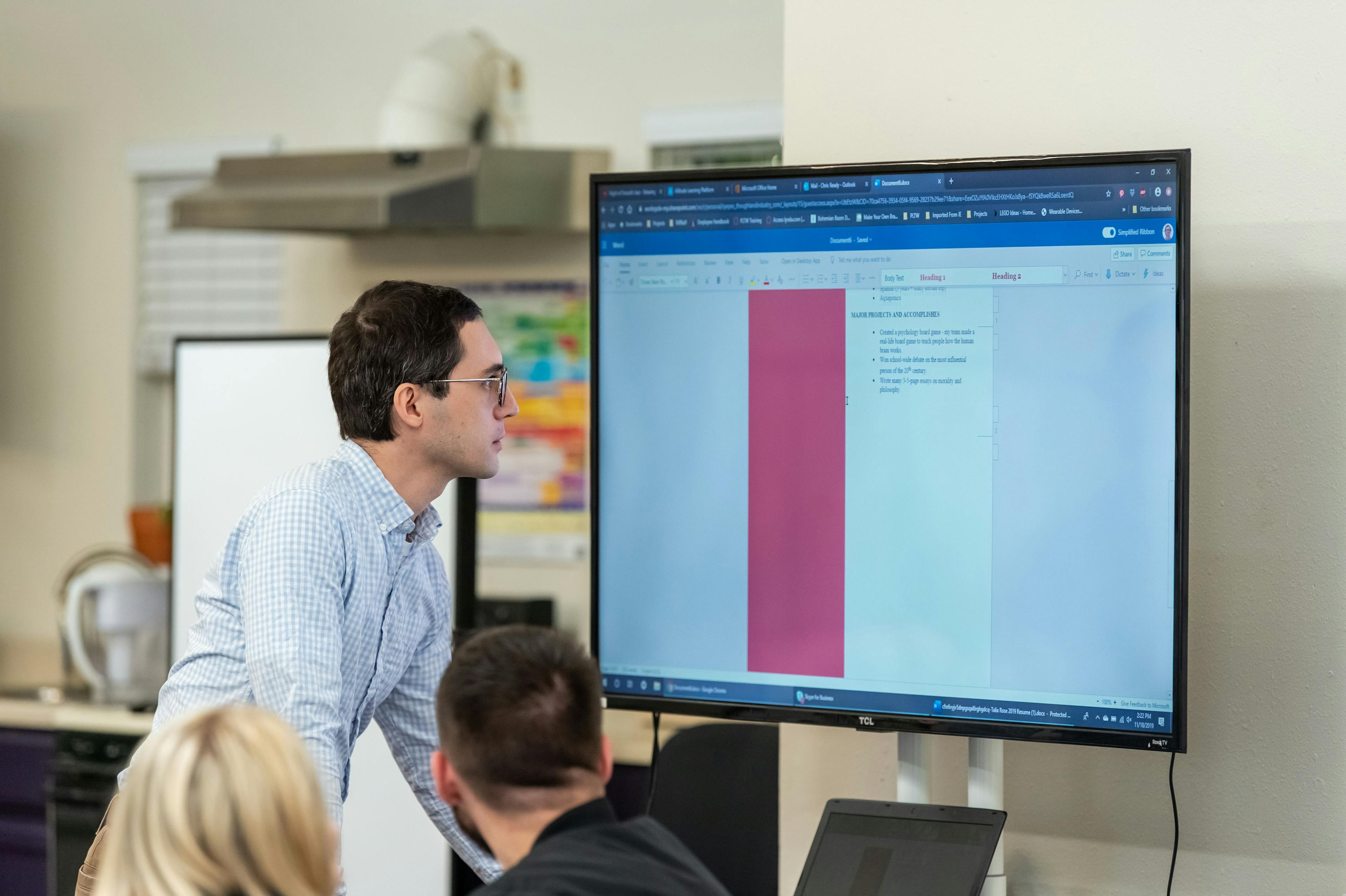 ati hollywood beach student standing in front of a computer screen in front of class