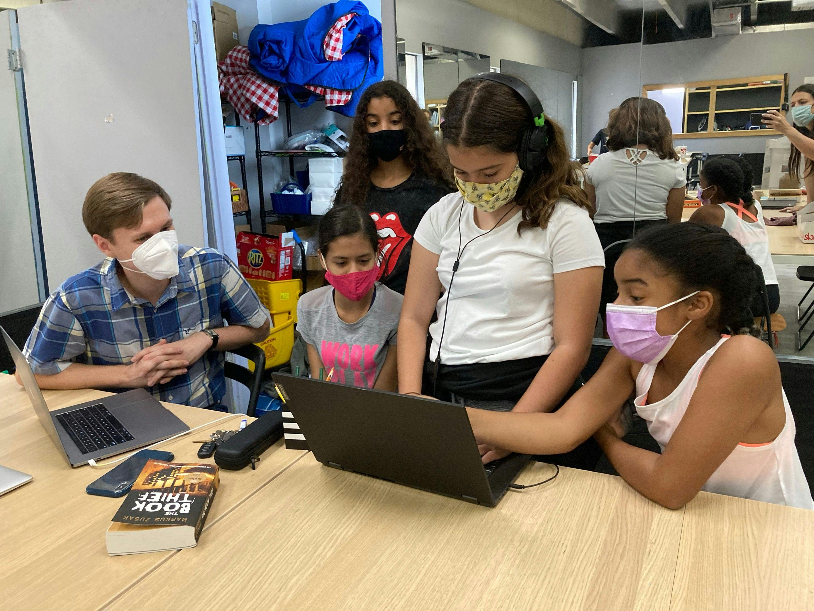 Guidepost Academy Museum Mile students in class working on a laptop