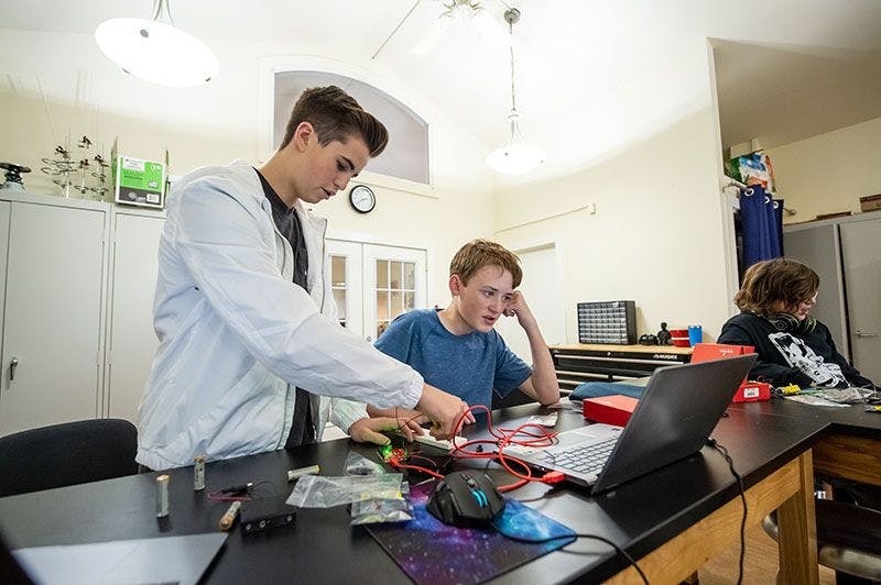 ati museum mile students working on a computer project